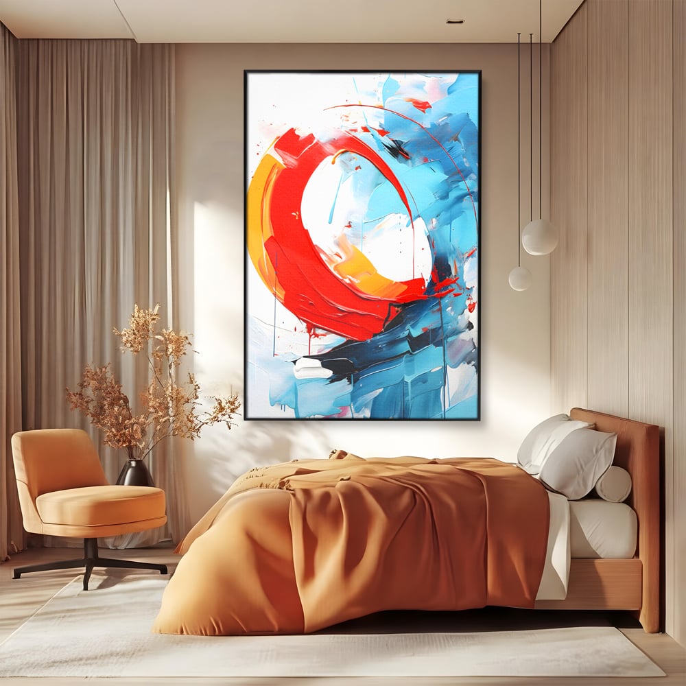 Tablou canvas cu pictura abstracta cu cerc rosu si tuse albastre, in rama de aluminiu negru, pe perete intr-un dormitor